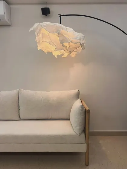 Close-up of the light-upholstered oak wood sofa.