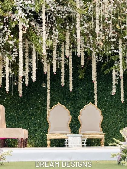 The ceremony stage viewed through a frame of soft purple flowers. This perspective shows how I layer elements to create depth and visual interest from every angle.