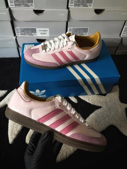 A side view of the pink bubblegum custom Sambas.