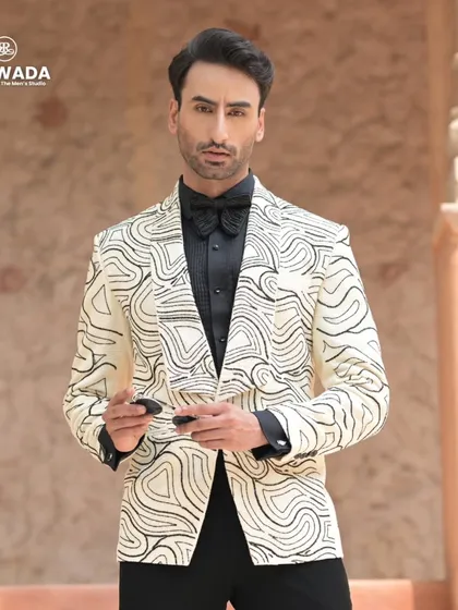The abstract tuxedo styled with confidence. The black and white contrast is timeless, while the pattern is completely contemporary.
