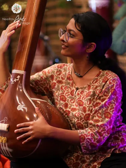This is a calmer side of my music. Pictured with a tanpura, this image reflects my training in Indian classical music, a foundation that I bring to my devotional and semi-classical performances for more intimate or traditional gatherings.