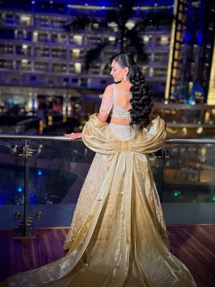 For a grand sangeet night, I created this full glam look. The focus was on creating a royal and impactful style that felt like a true Bollywood moment, complete with a dramatic gown and sparkling diamond jewelry.