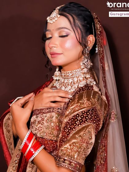 This image showcases a soft, romantic bridal look with a focus on glowing skin. It demonstrates the range of styles my students learn, from bold and traditional to subtle and modern.