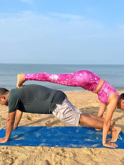 This stacked plank pose is a playful way to build serious strength. It requires core engagement from both partners and a great deal of trust and communication to hold the shape.