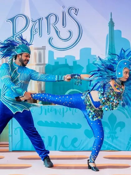 Part of our 'World Tour' carnival theme, this performance represented Paris. The dancers' blue feathered costumes and dynamic choreography brought the energy of a Parisian carnival to the stage.