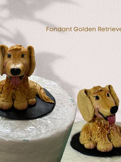 A close-up of a fondant Golden Retriever I sculpted for a cake. I love capturing the personality of beloved pets in edible form. This was made by yours truly!