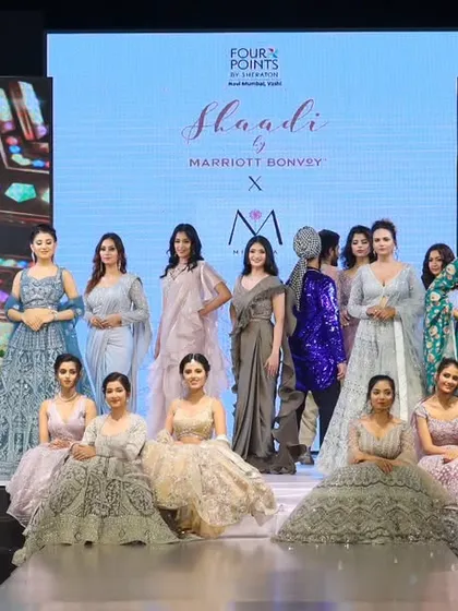A grand group shot from the 'Shaadi by Marriott Bonvoy' event, featuring all the models in a stunning array of bridal and festive wear.