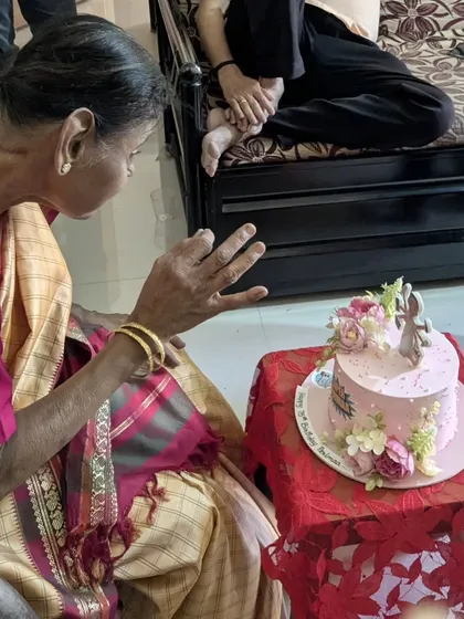 A close-up of the birthday lady admiring her personalized cake. These are the moments I cherish as a baker.