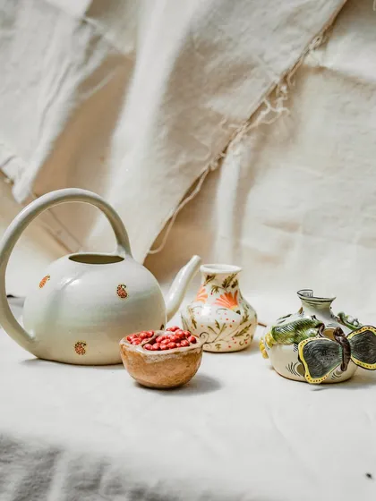 The results of our students' dedication speak for themselves. This collection, featuring a beautifully crafted teapot, a pomegranate bowl, and other unique pieces, showcases the diverse and imaginative work that comes out of our Foundation Course. Each piece tells a story of experimentation and personal expression.