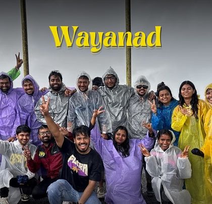 Rain or shine, the adventure in Wayanad never stops. Here's our group all geared up in raincoats, ready to explore the lush landscapes.