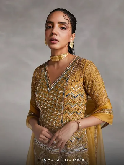 A stunning yellow kurti set, where fine fabrics, a modern silhouette, and signature embellishments create an unforgettable look.