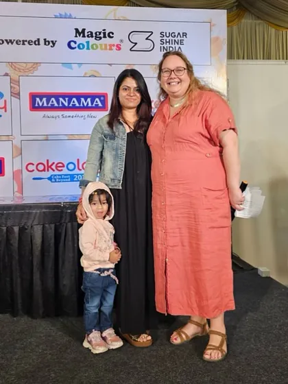 A photo with my daughter and one of the judges. My family's support means the world to me.