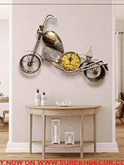 This classic bike-shaped metal wall decor includes a functional clock in its design. The antique golden finish and vintage motorcycle shape make it a standout piece for a den, office, or any space with a retro vibe.