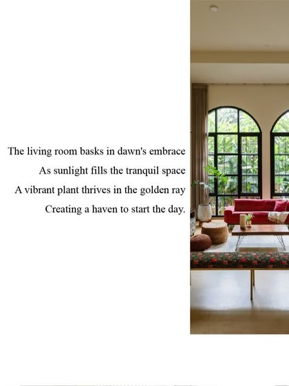 The living room at Casa 503, where large arched windows flood the space with morning light. The vibrant furniture and lush plants create a tranquil haven to start the day.