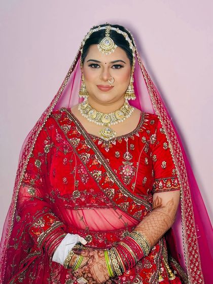 A happy and confident bride, ready for her big day. The makeup enhances her natural glow.