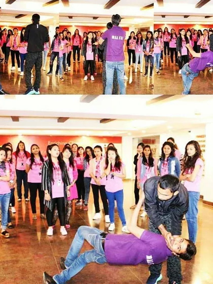 Demonstrating chokehold escapes and takedowns during a corporate self-defence workshop. These are practical skills for real-world threats.