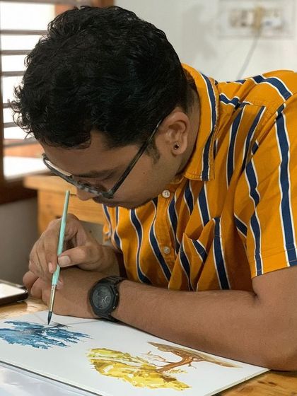 A student paints trees, learning to capture their form and texture. The cozy weather outside complements the calm and creative atmosphere inside our studio.