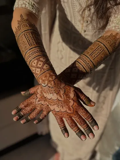 This is a custom-created bridal design, made to be completely unique for the bride. The patterns flow from the palm to the forearm, creating a cohesive and breathtaking piece of art.