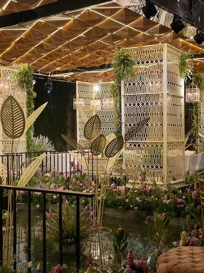 For this Mehendi sundowner, we built a custom floating island in a lotus pond, complete with intricate macrame structures and an illuminated ceiling. The entire space transformed as the sun set, creating a magical alfresco experience that was all heart.