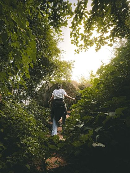 Walking through a natural green tunnel on the Skandagiri trail. The path is as beautiful as the destination itself.