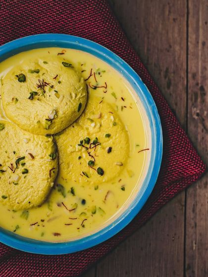 Our creamy Rasmalai is a must-try. Soft cottage cheese discs are soaked in thickened, sweetened milk, flavoured with saffron and cardamom, and garnished with pistachios.