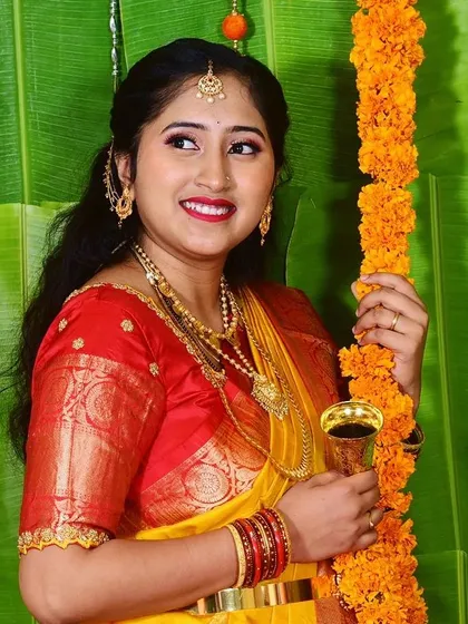 It’s not just about brides. I love creating special looks for the whole family. Here, I gave this happy mom a fresh, glowing look with a bold lip for her daughter's naming ceremony, ensuring she felt beautiful for the celebration.