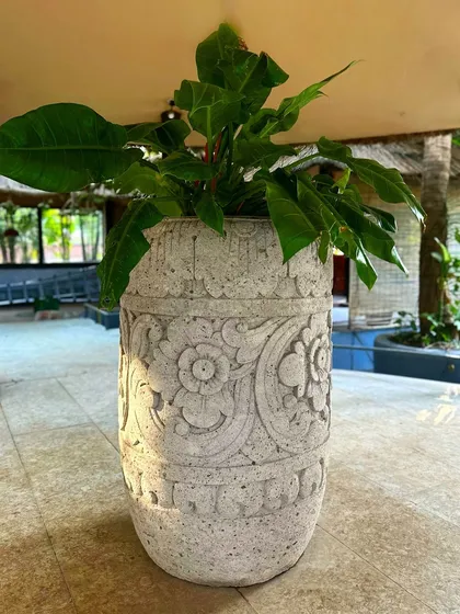 I'm so proud of the bestseller 'Puspa' planter, now available in a grand 120 CM size. The intricate, hand-carved floral details on this lavastone piece showcase the incredible skill of my Balinese artisans.