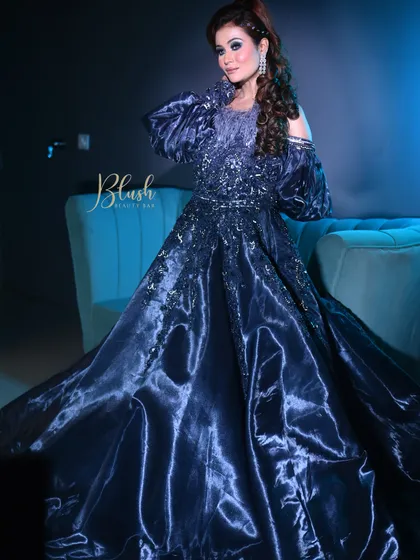 For a cocktail or reception event, we can go for a full glam look. This stunning blue gown inspired a dramatic eye and sculpted features, creating a high-fashion, memorable look that is perfect for an evening party.
