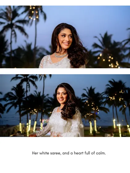 A beautiful shot of Amrisha against a backdrop of palm trees and twilight. Her white saree and calm demeanor create a serene and elegant picture.