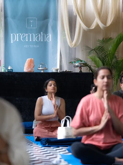 Participants in a state of prayer and meditation during our Premaha workshop. It doesn't matter your experience level; what matters is showing up with an open heart.