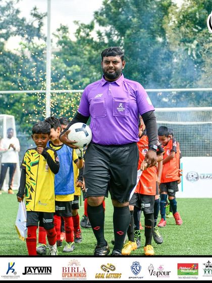 The walkout. Led by the referee, our U9 players enter the pitch with focus and determination for the MDL Tournament final.