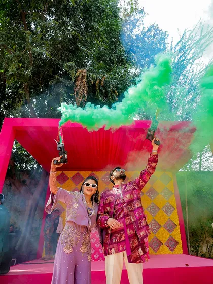 The couple makes a colorful entry with smoke bombs, adding a modern and fun twist to their celebration. These moments make for incredible, high-energy photos.