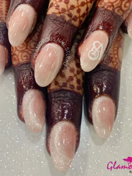 Personalize your bridal look with a special touch. These elegant, shimmery cat-eye effect nails are finished with a delicate, hand-painted initial. It's a subtle yet meaningful way to make your wedding day manicure uniquely yours.