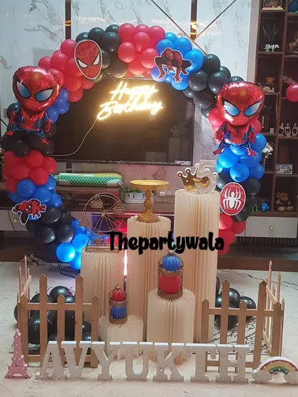 Superhero parties are always full of energy. Here is a Spiderman theme I created, featuring a dynamic red, blue, and black balloon arch, character cutouts, and a cool 'Happy Birthday' neon sign that really makes the setup pop.