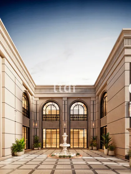 This grand courtyard is the heart of a classically inspired residence. The symmetrical design, towering arches, and central fountain evoke a sense of timeless European elegance, creating a dramatic and sophisticated arrival experience.