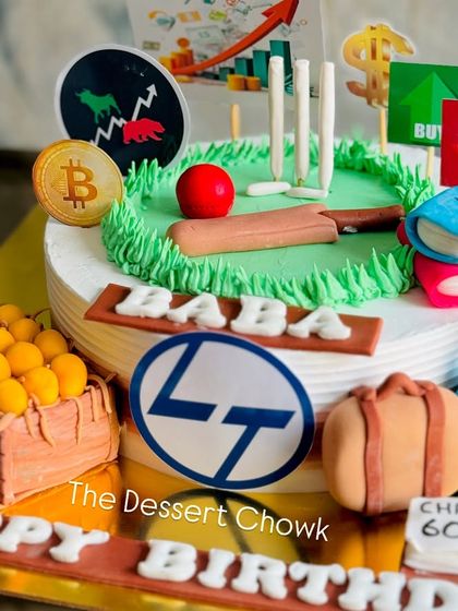 Another view of the multi-themed hobby cake, showing the detail of the fondant luggage, books, and stock market charts.