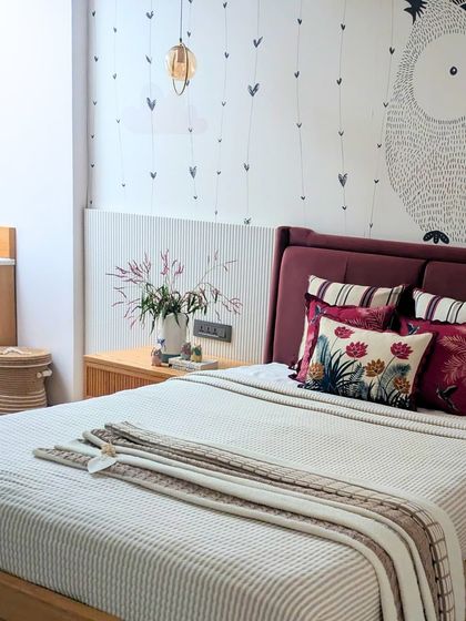 A glimpse into our Baan Sukh project, where art and greenery are woven into every corner. This bedroom detail shows a custom fluted wall panel and a bed dressed in rich textiles, reflecting a home that is alive with nature and tradition.