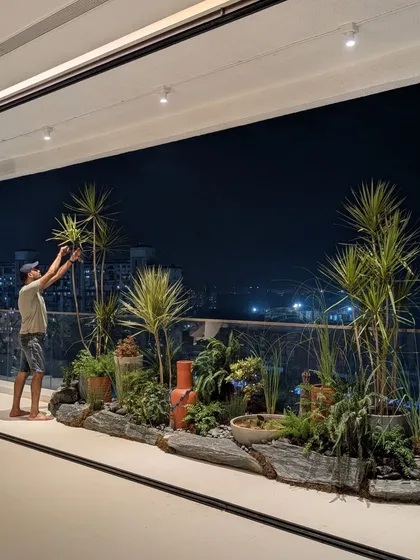 Our co-founder, Angud, giving the finishing touches to an ambitious rock garden on a client's deck. This shows our hands-on approach to making every detail perfect.