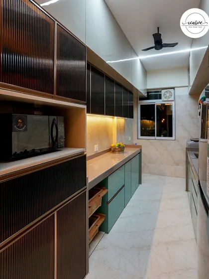 Another shot of the parallel kitchen, focusing on the built-in microwave and storage units.