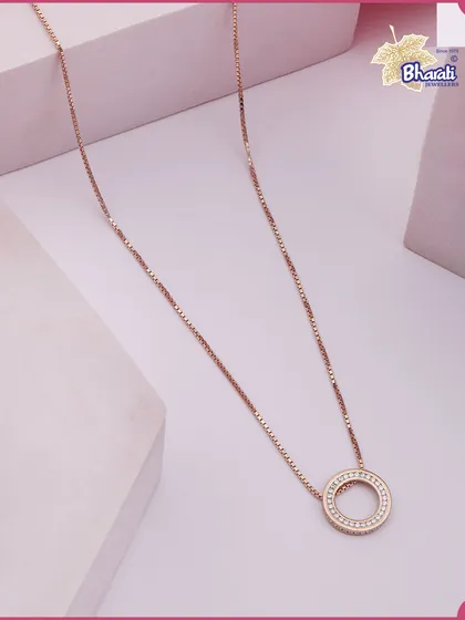 The essence of quiet luxury. This delicate Circle of Eternity pendant in rose gold is a testament to timeless design, perfect for adding a touch of grace to your daily ensemble or for elegant layering.