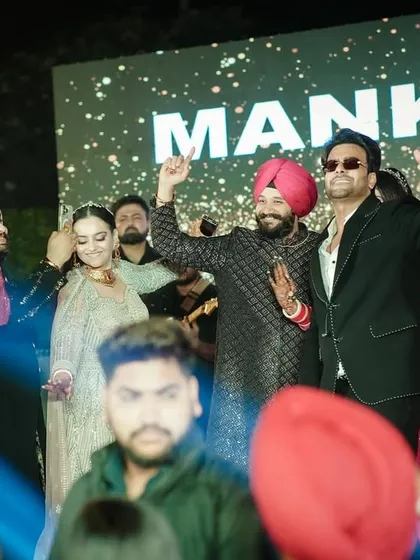 Capturing the energy of the crowd and the stage during a celebrity performance at a wedding.