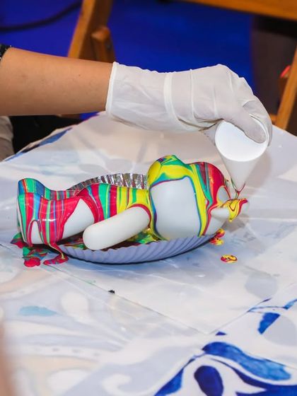 Another guest tries their hand at the mesmerizing fluid bear painting activity.
