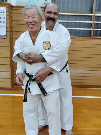 A lighthearted moment with a respected master in Okinawa. The bonds we build go beyond training; they are friendships built on a shared passion for karate.