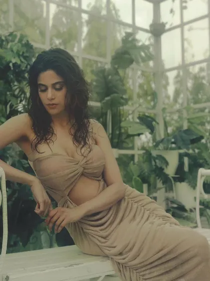 A closer look at the soft glam makeup in the greenhouse setting. The focus is on the beautifully blended eyeshadow and the radiant, dewy finish on the skin.