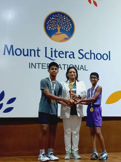 Kabir and Anay Arlekar receiving their Gold medal for the Team Event in U14 Boys Doubles at the Mount Litera School Badminton Tournament.
