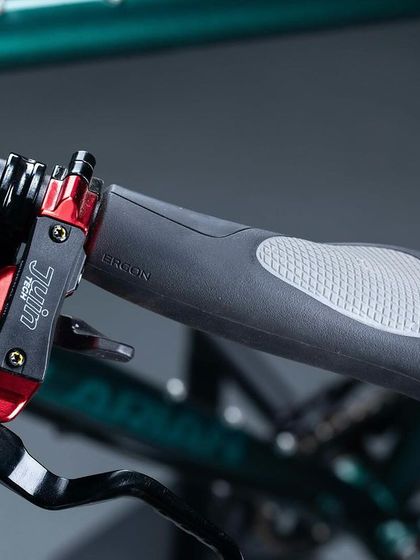 Another view of the brake levers and shifters. The setup is chosen for its reliability and ease of use, giving you confident control whether you're navigating city streets or remote mountain roads.