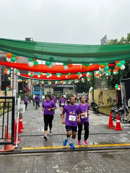 Runners at the DLF Freedom Run make their way through a course decorated in the national colors. I ensure every event has a professional and festive atmosphere, from the track setup to the branding.