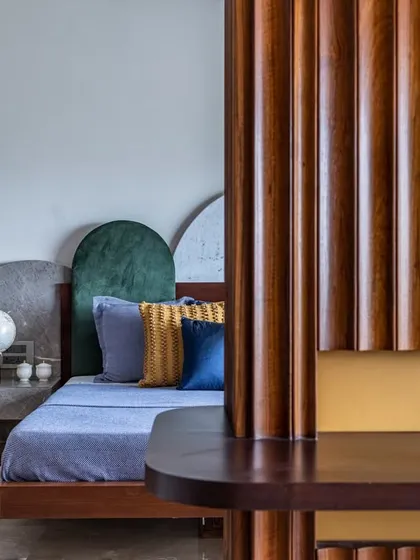 A master suite should be a personal sanctuary. For this Mumbai home, I designed a space where unique forms and textures meet effortless calm. The custom-arched headboard and thoughtful details create a curated, cozy retreat that whispers relaxation.