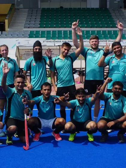 The spirit of hockey brings people together. Here, my players celebrate with a visiting team after a great game, showcasing the sportsmanship and global community we foster at the academy.