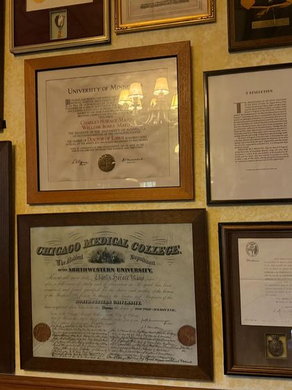 Framed degrees and documents at the Mayo Clinic. These represent a long history of medical excellence and dedication, a tradition we aim to honor in our own work at Eugenix.